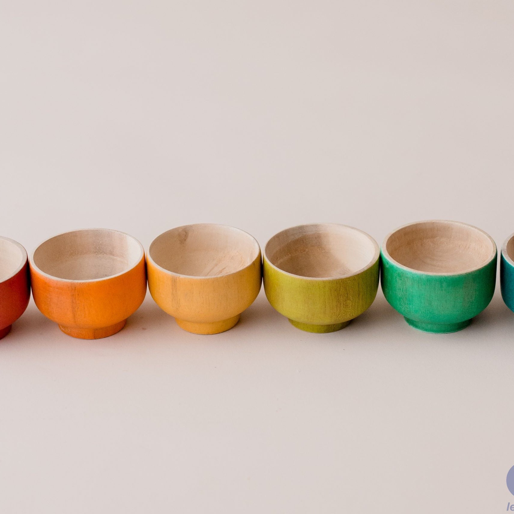 Set of colorful ceramic bowls on a light background